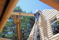 Independent Representative Constructing Log Home